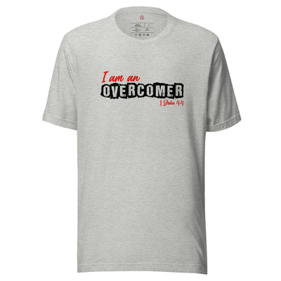 I am an Overcomer unisex t-shirt. 1 John 4:4 bible verse noted in red below image.OverComer. Cotton t-shirt, great quality and flattering fit. Image in white and red. T-shirt shown in athletic heather.