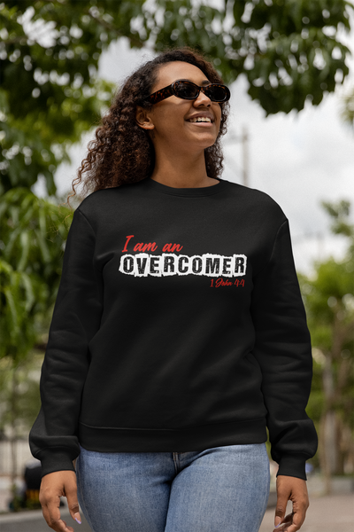 Overcomer unisex fleece sweatshirt. Image displays 1John4:4 verse below design. If you're on the lookout for both style and comfort, this fleece sweatshirt is the perfect choice. And with up to 5% recycled polyester in components, you'll be taking a little step closer to a more earth-friendly way of life. Sweatshirt shown in black