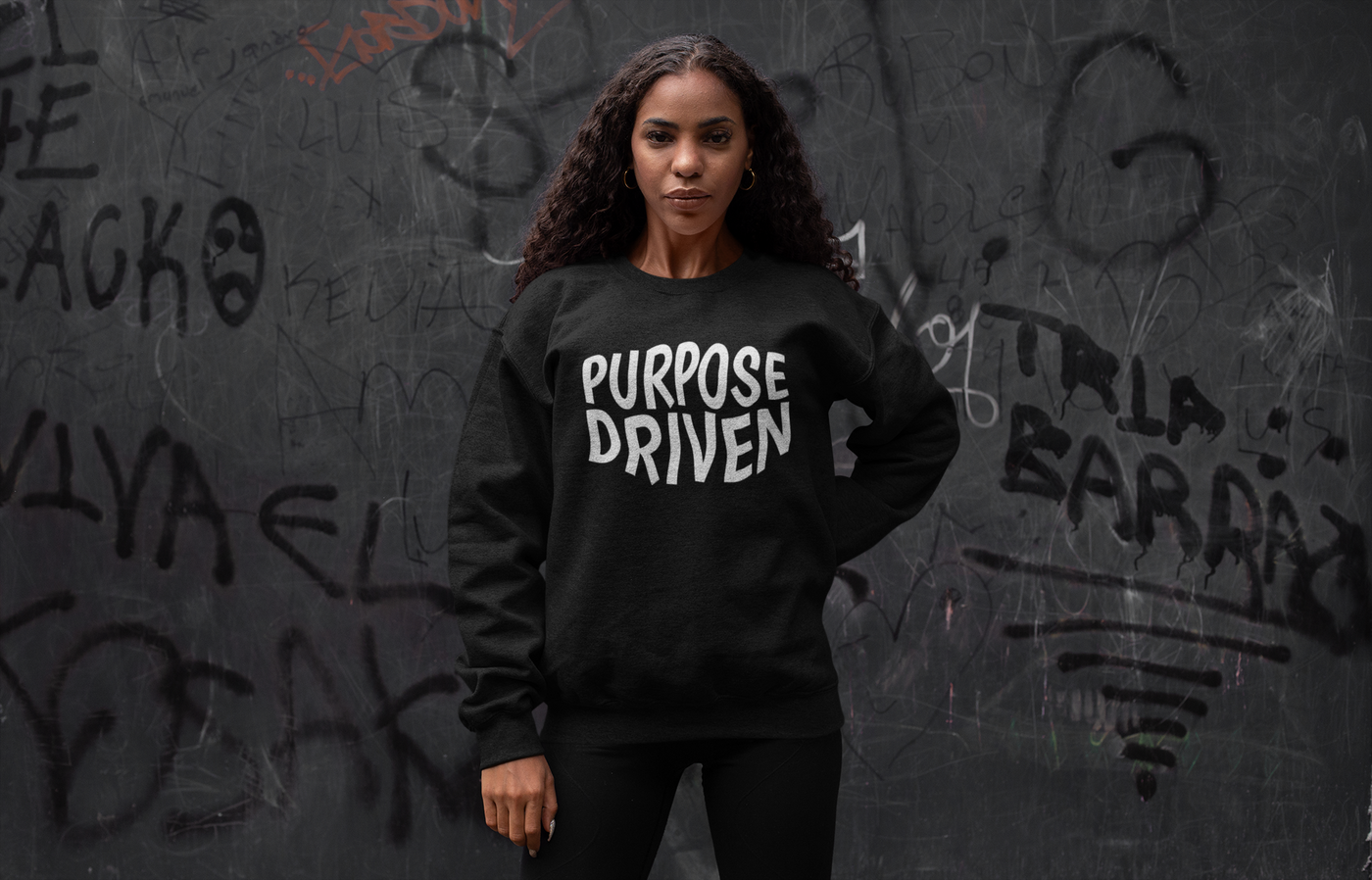 Purpose Driven black sweatshirt. Design message "Purpose Driven". Sweatshirt is a standard length.  Fabric is soft on skin. 