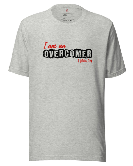 I am an Overcomer unisex t-shirt. 1 John 4:4 bible verse noted in red below image.OverComer. Cotton t-shirt, great quality and flattering fit. Image in white and red. T-shirt shown in athletic heather.